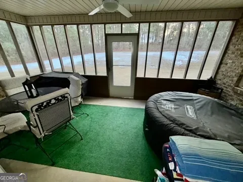 a view of a bathroom with a sink and a mirror