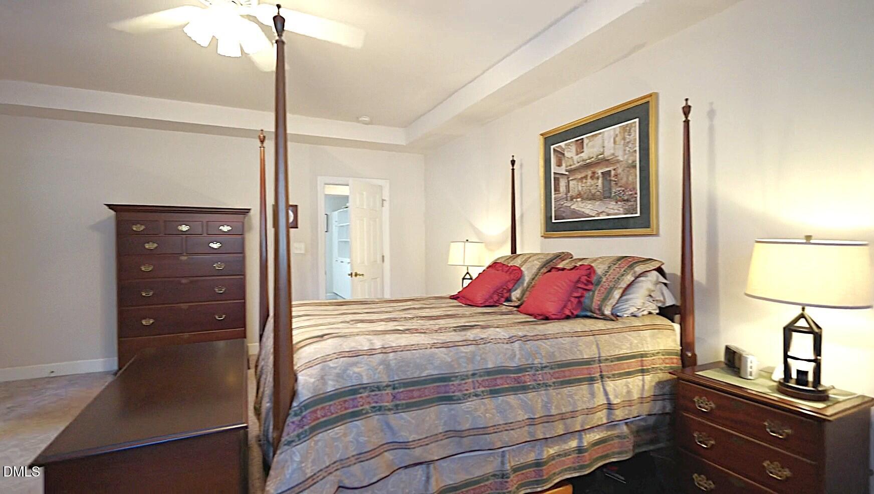 220 Jordan Narron Road Selma, NC 27576 - Photo 34 of 87 a bedroom with a bed and a lamp on dresser