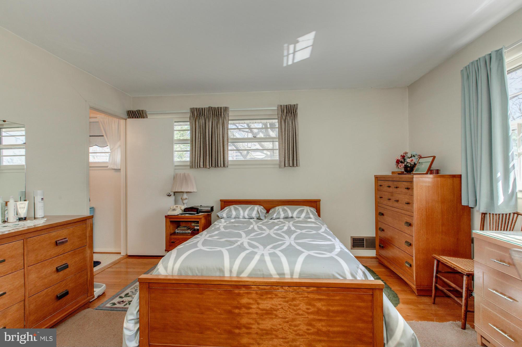 5508 Inverchapel Road Springfield, VA 22151 - Photo 14 of 29 a bedroom with a bed and a dresser