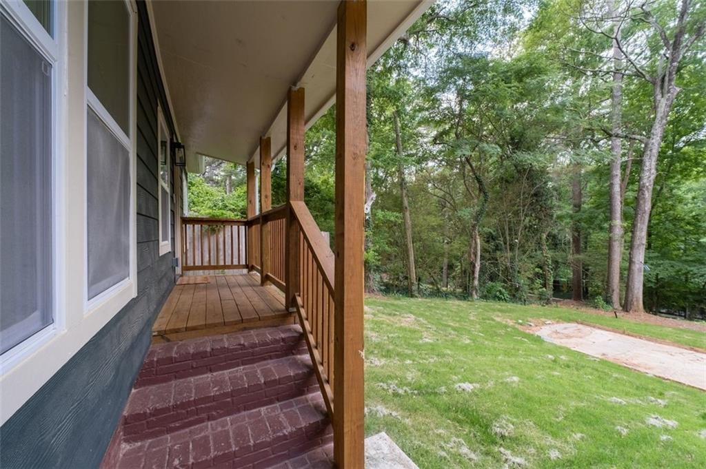 965 Houston Mill Road Northeast Atlanta, GA 30329 - Photo 5 of 42 a view of balcony with wooden floor and fence