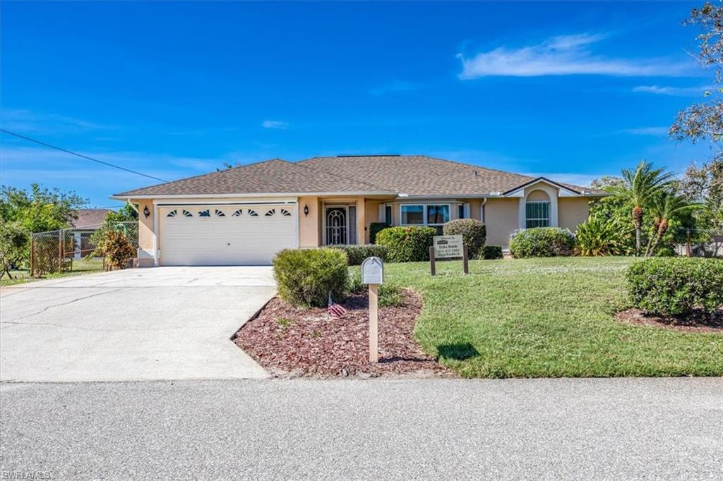 17520 Homewood Road Fort Myers, FL 33967 - Photo 1 of 24 a front view of a house with a yard