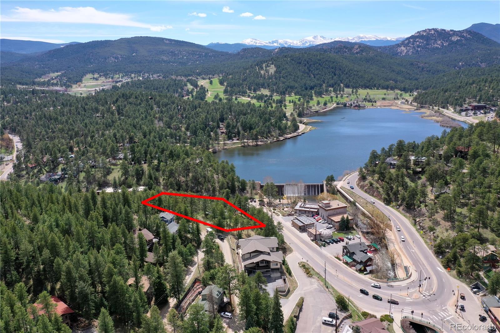 an aerial view of a house and outdoor space