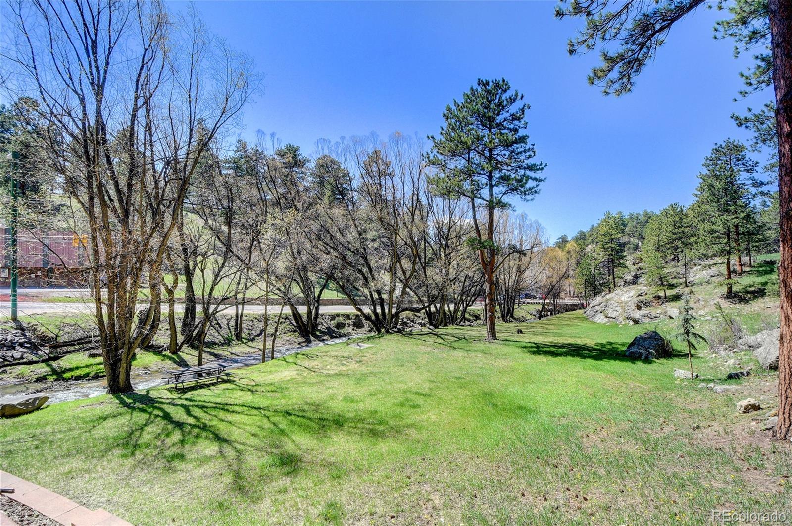 4690 Highway 73 Evergreen Co 80439 Evergreen, CO 80439 - Photo 31 of 34 a view of a park with large trees