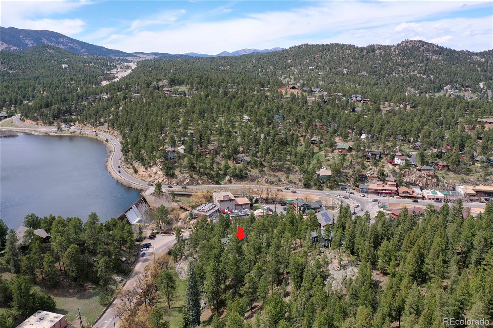 4690 Highway 73 Evergreen Co 80439 Evergreen, CO 80439 - Photo 5 of 34 a view of a lush green hillside and houses