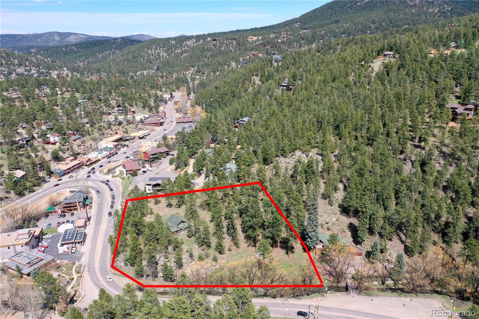 4690 Highway 73 Evergreen Co 80439 Evergreen, CO 80439 - Photo 7 of 34 a view of a houses with a lush green hillside