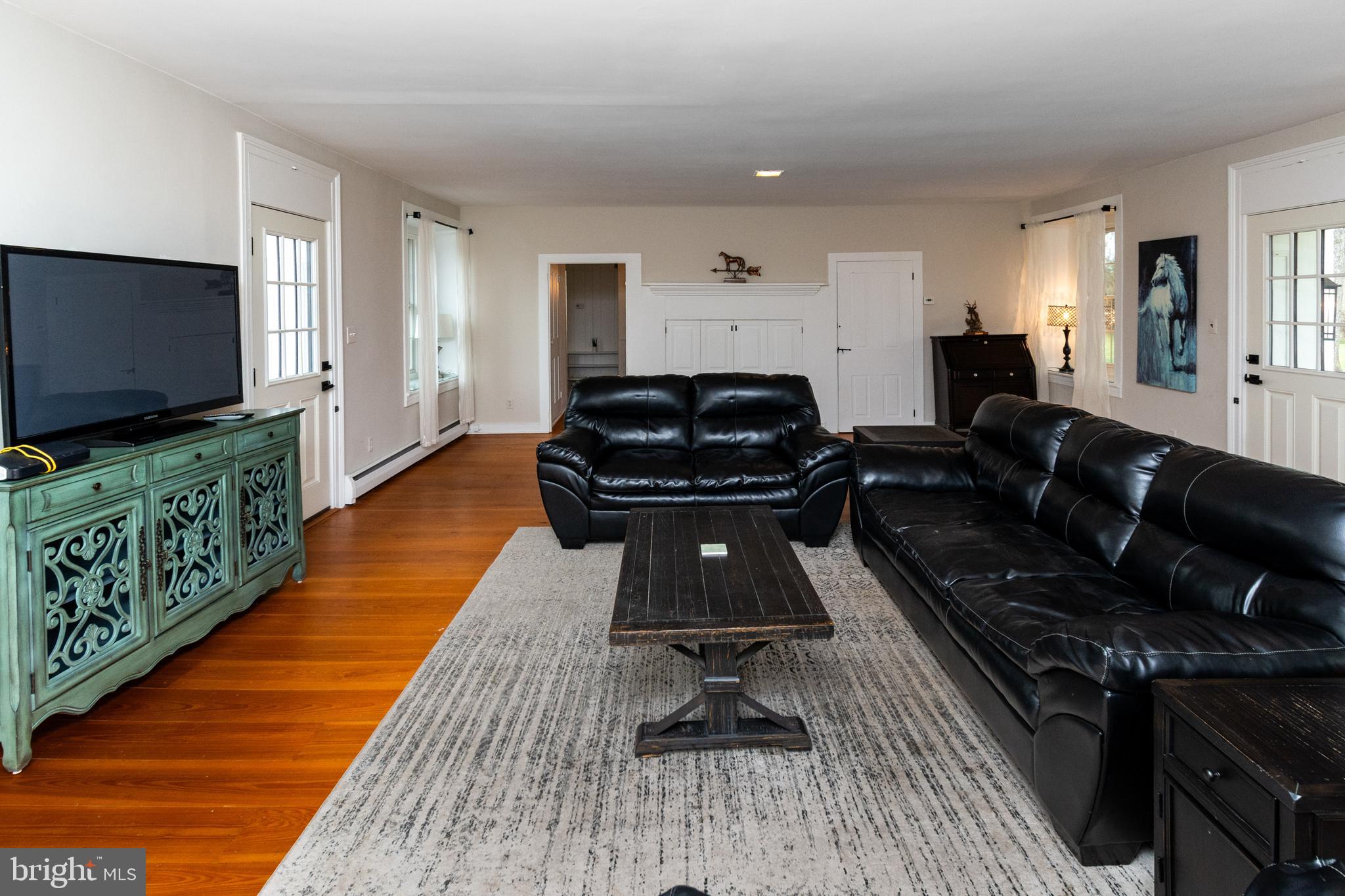 180 Municipal Road Pipersville, PA 18947 - Photo 17 of 60 a living room with furniture and a flat screen tv