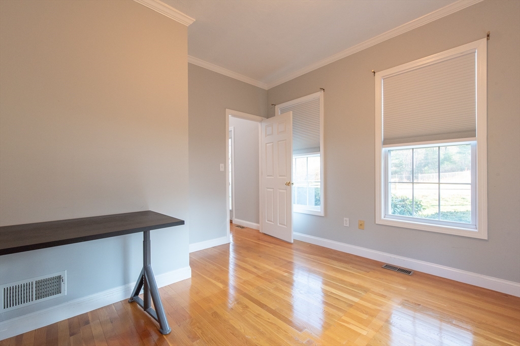 7 Buffy Road Bellingham, MA 02019 - Photo 15 of 34 an empty room with wooden floor and windows