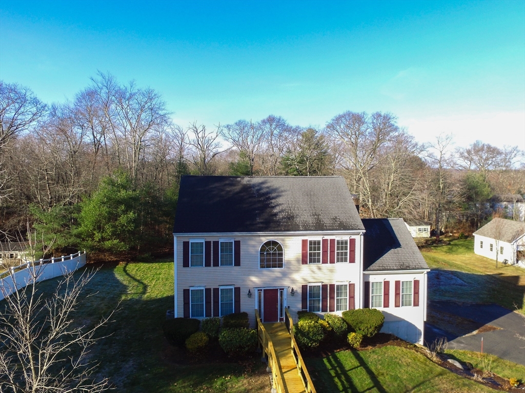 7 Buffy Road Bellingham, MA 02019 - Photo 2 of 34 aerial view of a brick house with a yard and plants