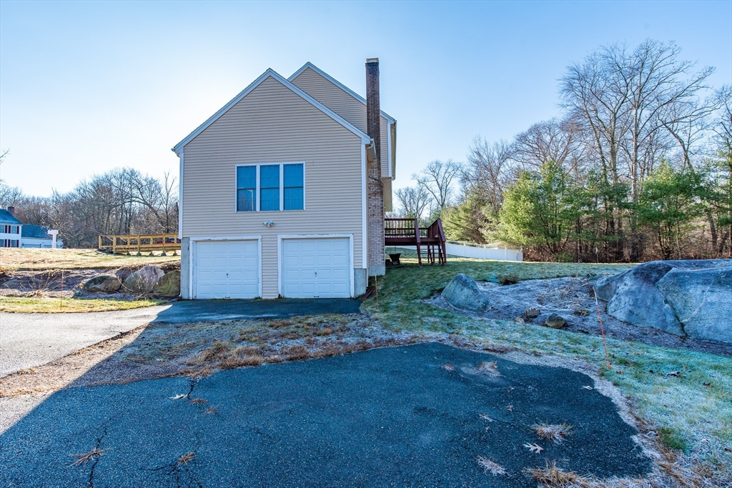 7 Buffy Road Bellingham, MA 02019 - Photo 32 of 34 a view of a house with backyard and trees