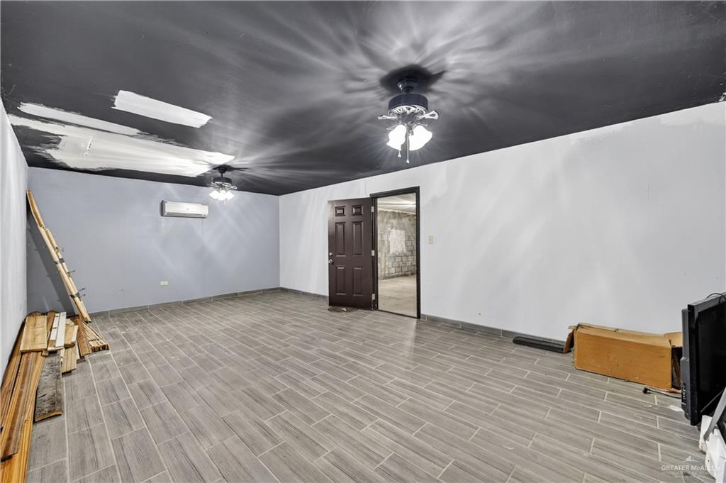 1424 North Sky Soldier Road Weslaco, TX 78596 - Photo 16 of 33 wooden floor in an empty room
