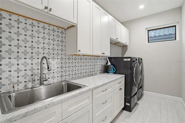 a living room with furniture a rug and a fireplace