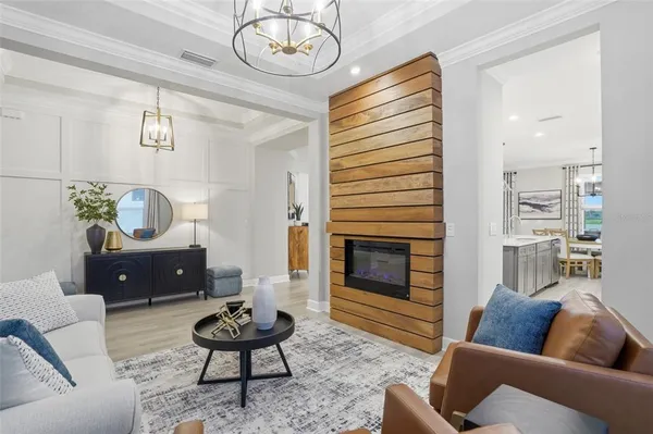 a living room with furniture and large windows