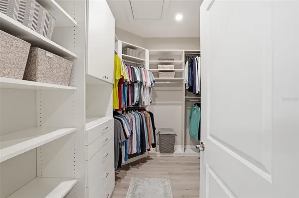 a view of a patio with a table and chairs under an umbrella