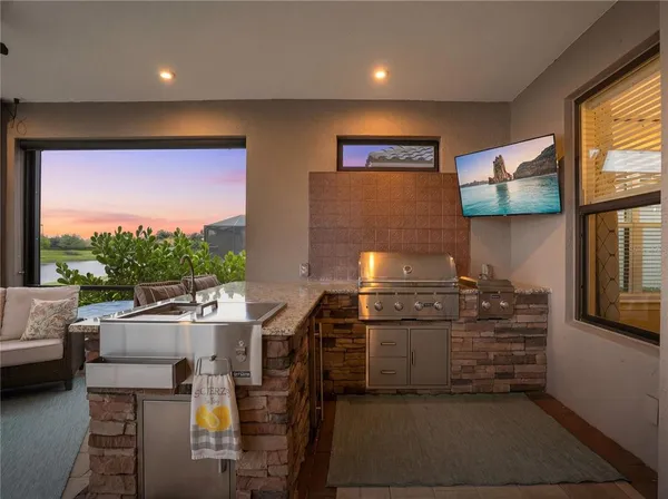 an aerial view of house with lake view