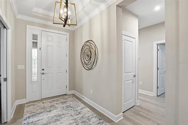 a view of a hallway with entryway door