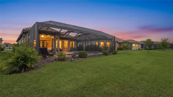 a kitchen with a table and chairs in it