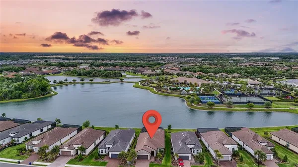 an aerial view of a house with a swimming pool