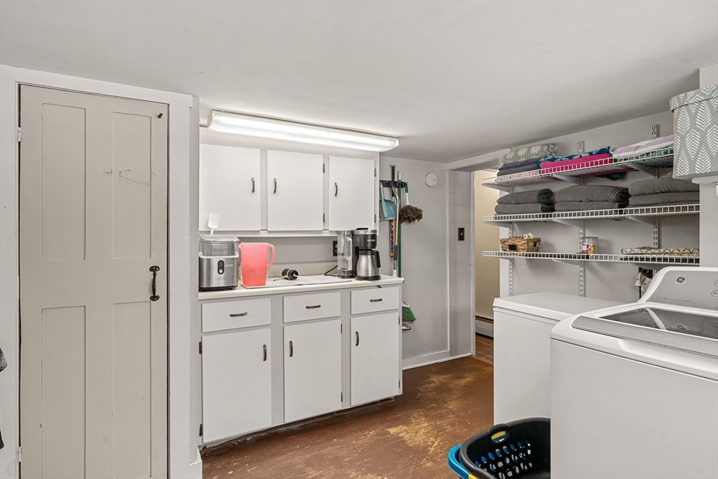 600 Main Street Ashby, MA 01431 - Photo 22 of 40 a kitchen with white cabinets and white appliances