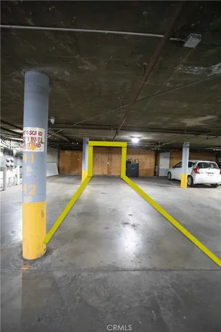 a view of parking garage with cars