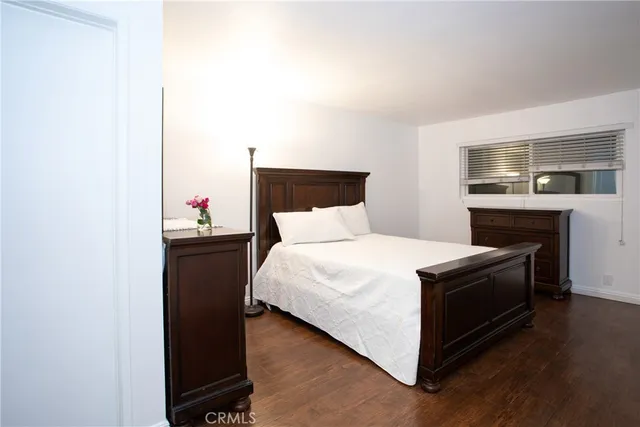 a bedroom with a bed and a fireplace