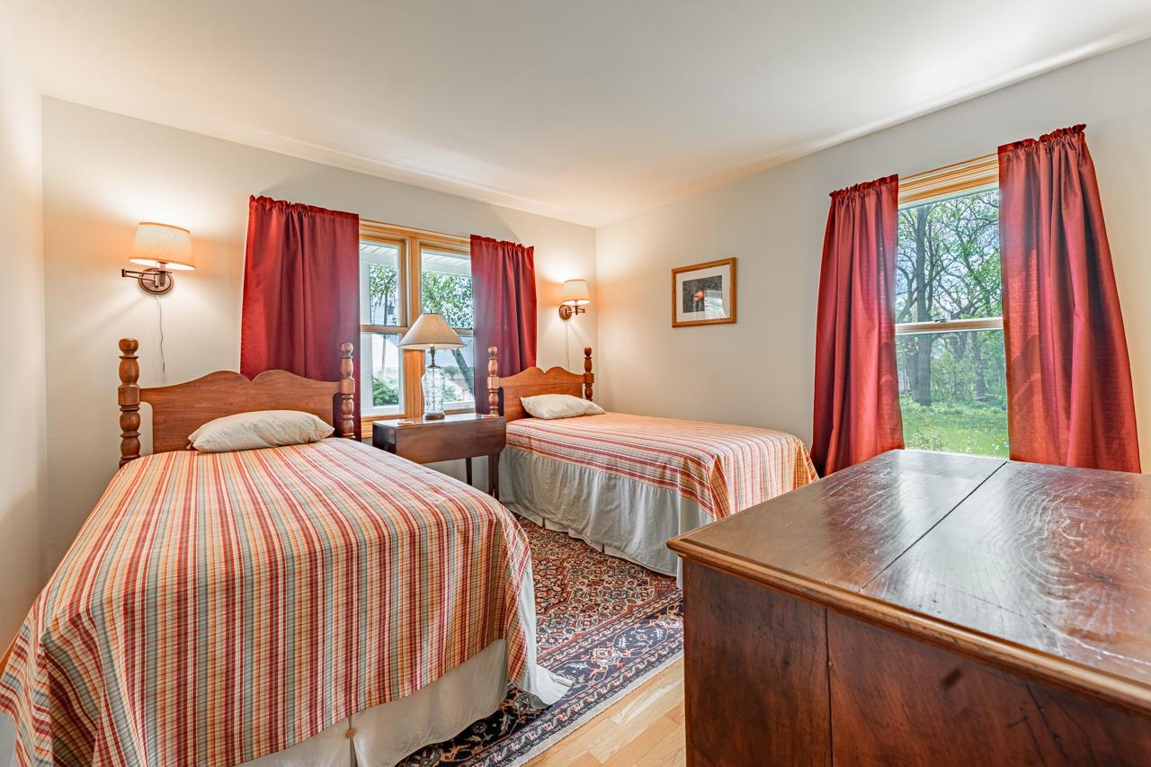 3013 Pagles Road Harvard, IL 60033 - Photo 17 of 35 a bedroom with two beds and a large window