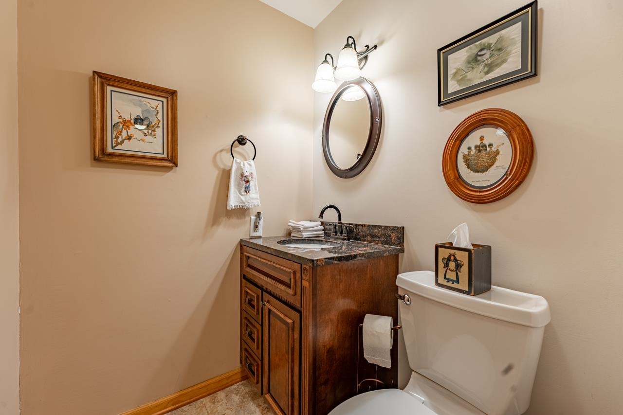3013 Pagles Road Harvard, IL 60033 - Photo 22 of 35 a bathroom with a toilet a sink and a mirror