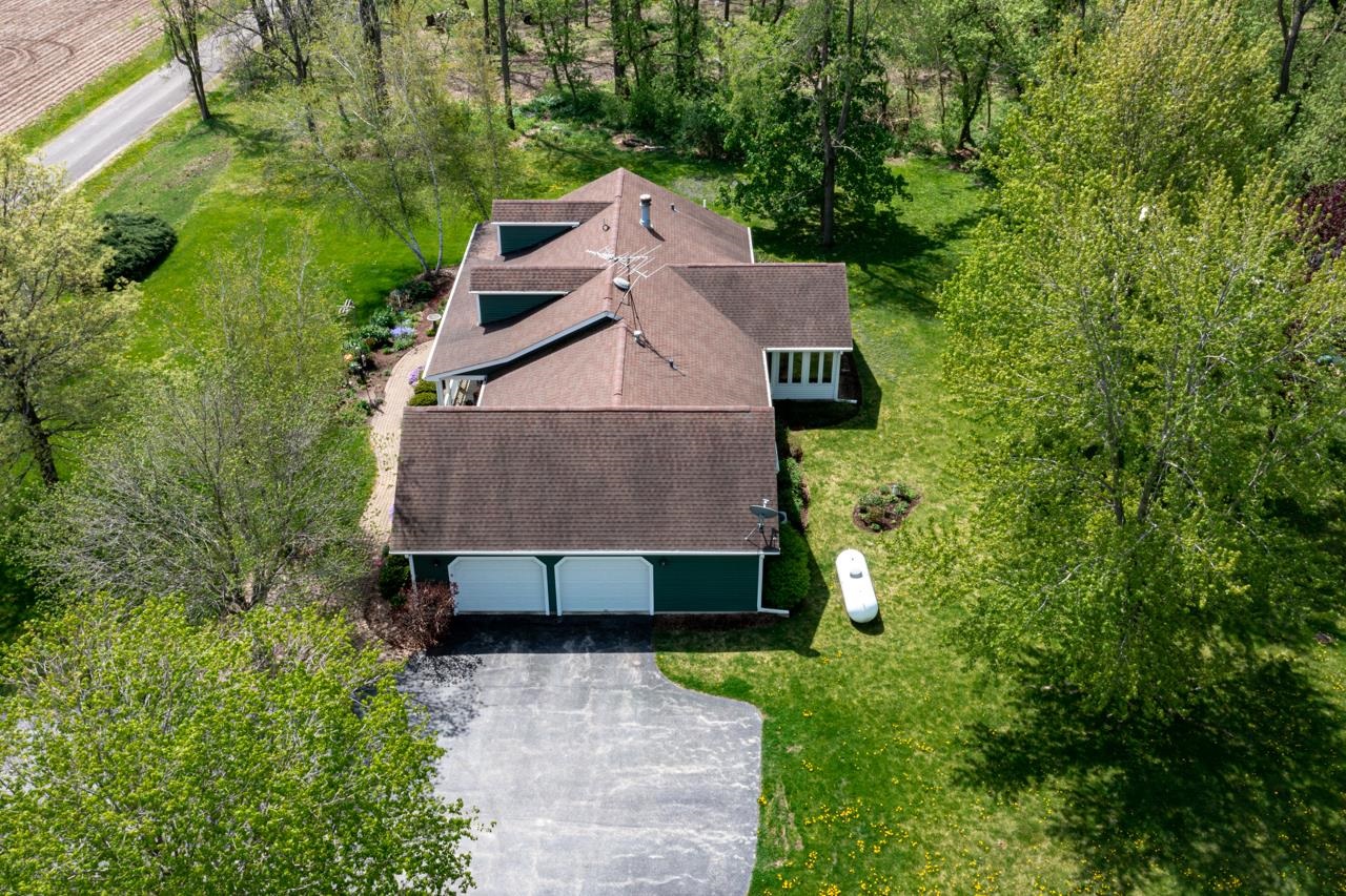 3013 Pagles Road Harvard, IL 60033 - Photo 4 of 35 an aerial view of a house with a yard and large tree