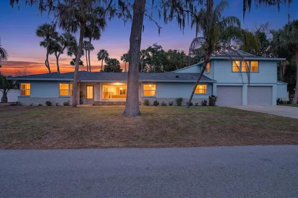 an aerial view of a house with outdoor space and street view