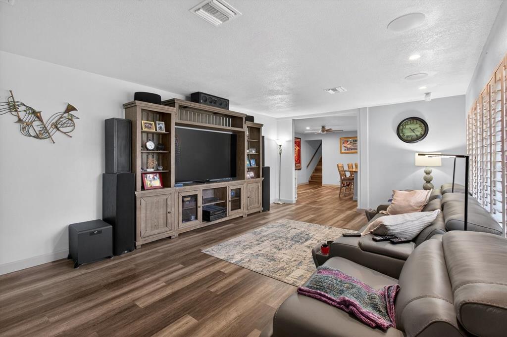 5539 Delaware Avenue New Port Richey, FL 34652 - Photo 22 of 95 a living room with furniture and a flat screen tv