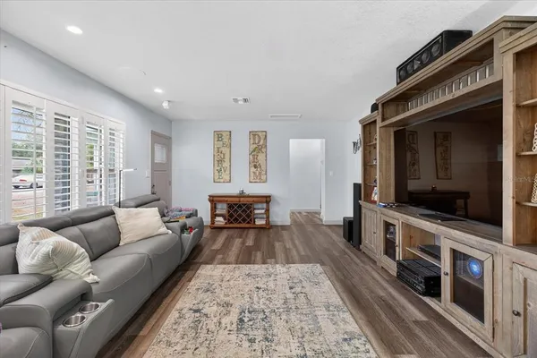 a view of a dining room with furniture window and wooden floor