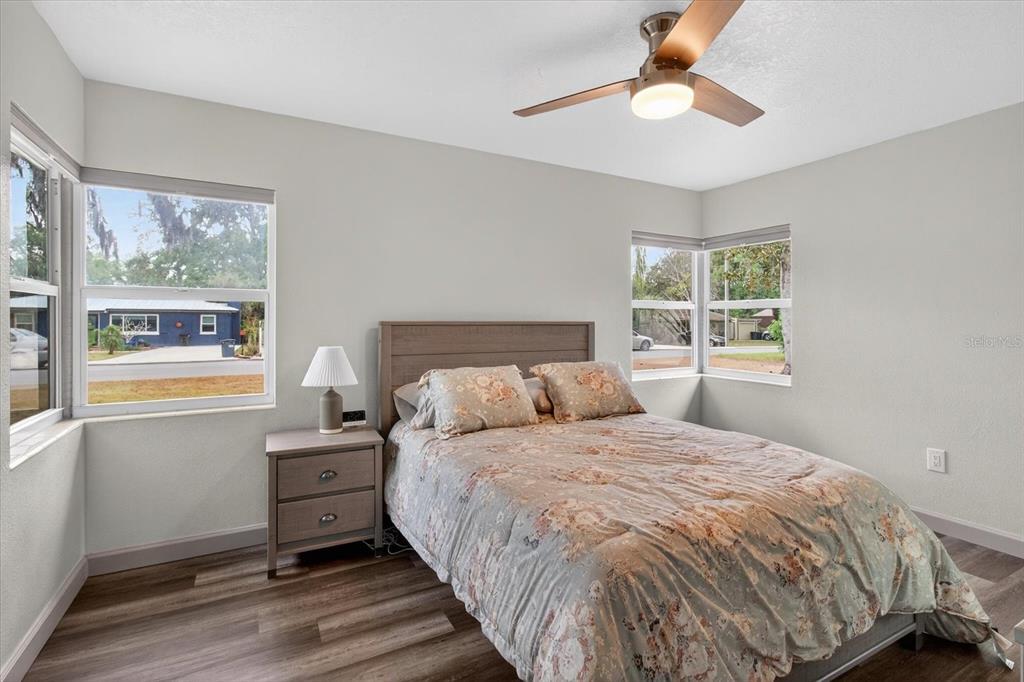 5539 Delaware Avenue New Port Richey, FL 34652 - Photo 24 of 95 a bedroom with a large bed and a window