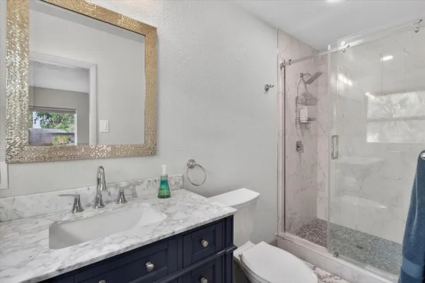 a kitchen with stainless steel appliances granite countertop a stove and a sink