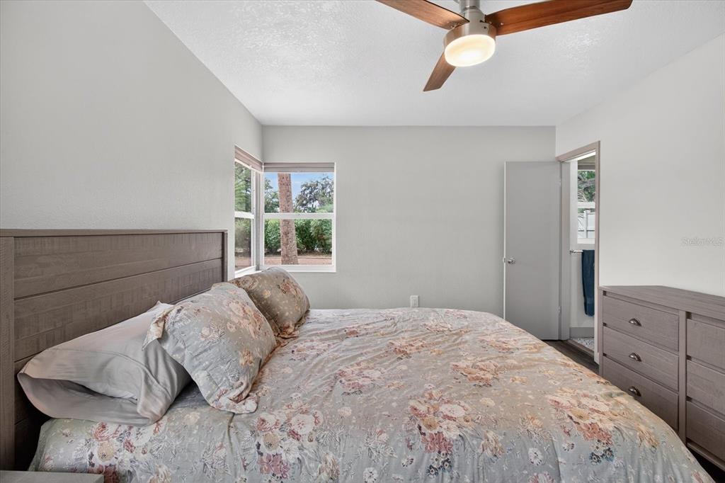 5539 Delaware Avenue New Port Richey, FL 34652 - Photo 29 of 95 a bedroom with a bed and window