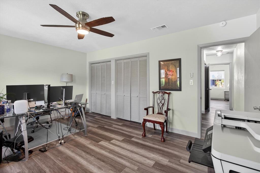 5539 Delaware Avenue New Port Richey, FL 34652 - Photo 31 of 95 a living room with furniture and a flat screen tv