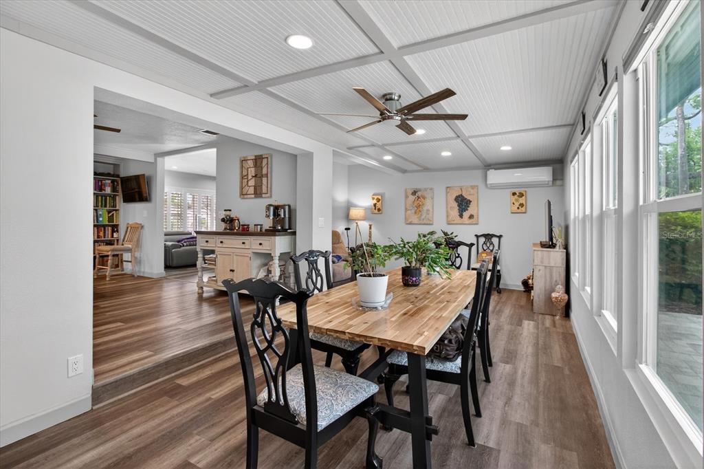 5539 Delaware Avenue New Port Richey, FL 34652 - Photo 39 of 95 a view of a dining room with furniture window and wooden floor