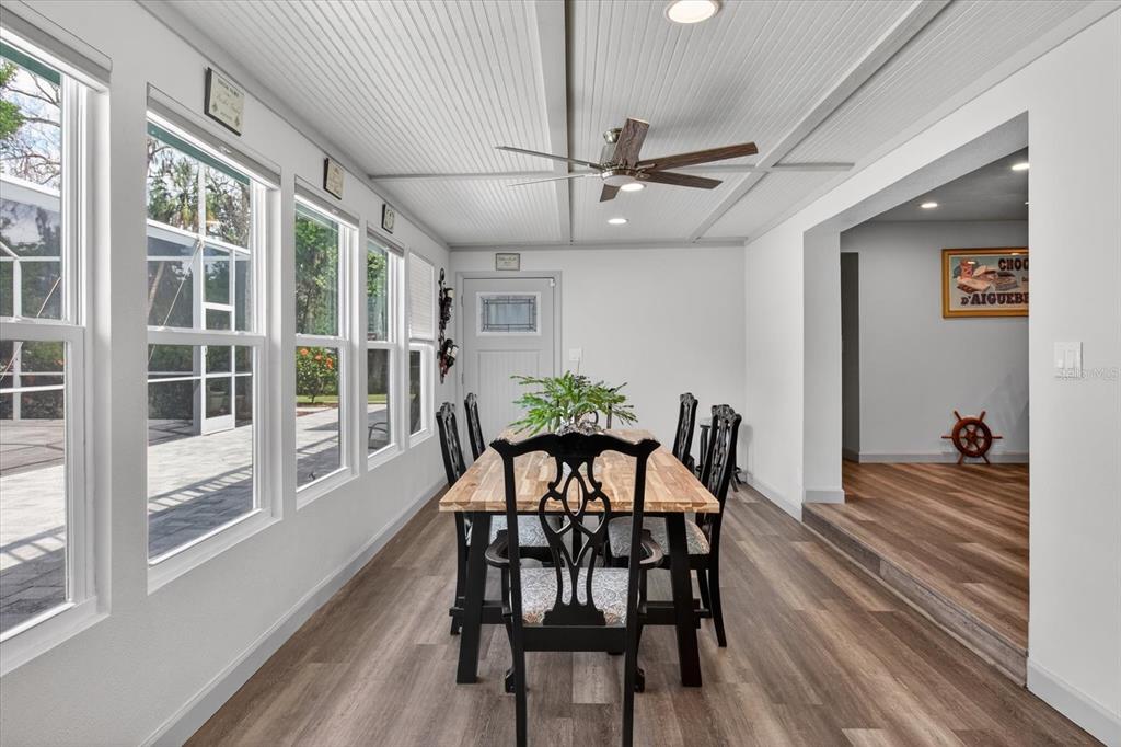 5539 Delaware Avenue New Port Richey, FL 34652 - Photo 40 of 95 a view of a dining room with furniture window and wooden floor