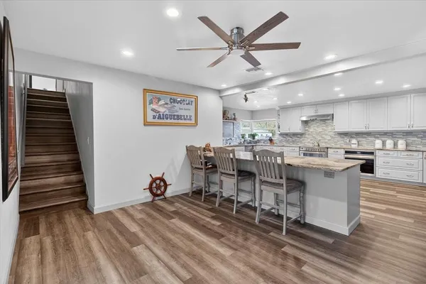 a front view of a house with a garden and yard