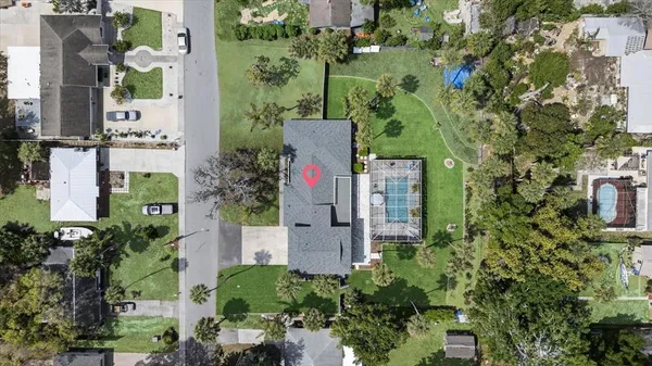 a view of a house with garden and trees