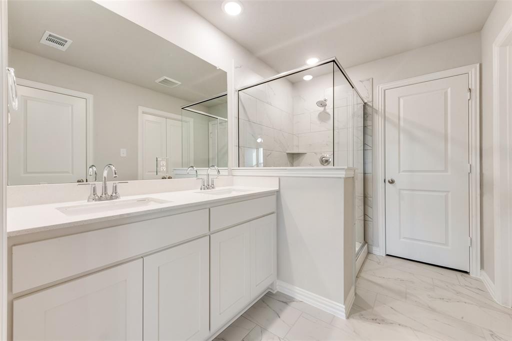 1505 Sutter Mill Road Saginaw, TX 76131 - Photo 18 of 21 a bathroom with a double vanity sink mirror and double