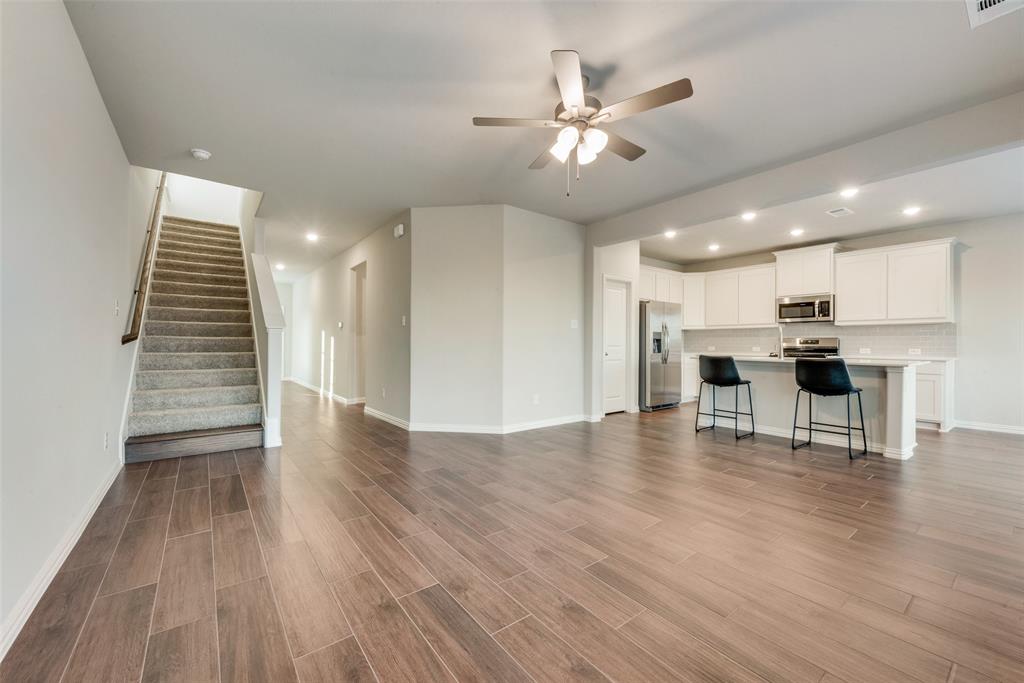 1505 Sutter Mill Road Saginaw, TX 76131 - Photo 7 of 21 a view of kitchen with furniture and wooden floor
