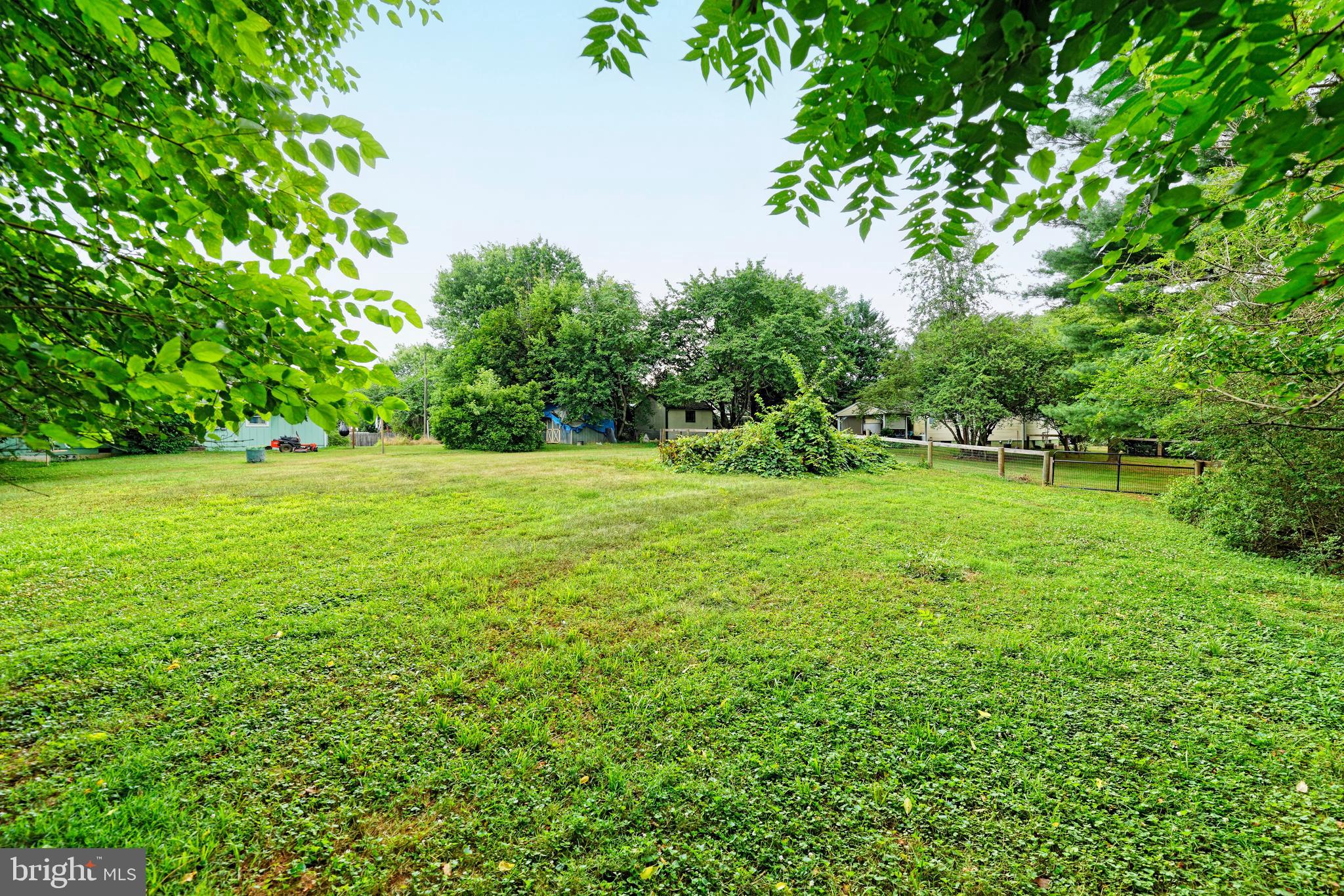 4 Chestnut Street Middleburg, VA 20117 - Photo 8 of 15 a view of a grassy field with trees in the background