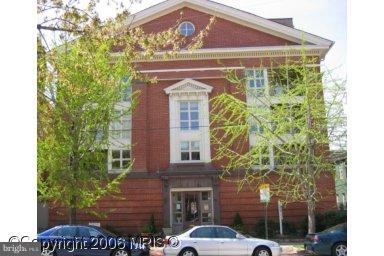 820 William Street, Unit 102 Baltimore, MD 21230 - Photo 1 of 14 a front view of a house with a garden