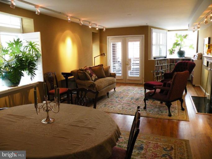 820 William Street, Unit 102 Baltimore, MD 21230 - Photo 2 of 14 a living room with furniture and a large window