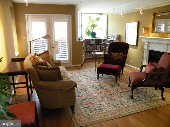 820 William Street, Unit 102 Baltimore, MD 21230 - Photo 12 of 14 a living room with furniture and a fireplace