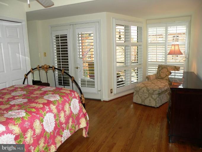 820 William Street, Unit 102 Baltimore, MD 21230 - Photo 5 of 14 a bedroom with a bed and wooden floor