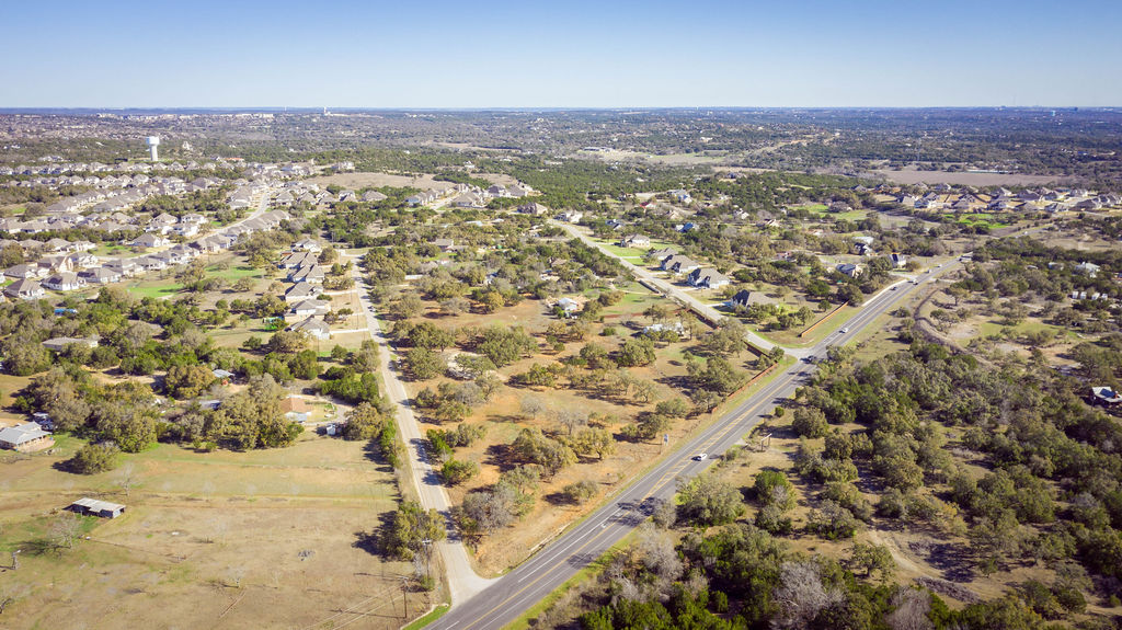 268 Kinnikinik Loop Austin, TX 78737 - Photo 16 of 23 an aerial view of residential houses with outdoor space