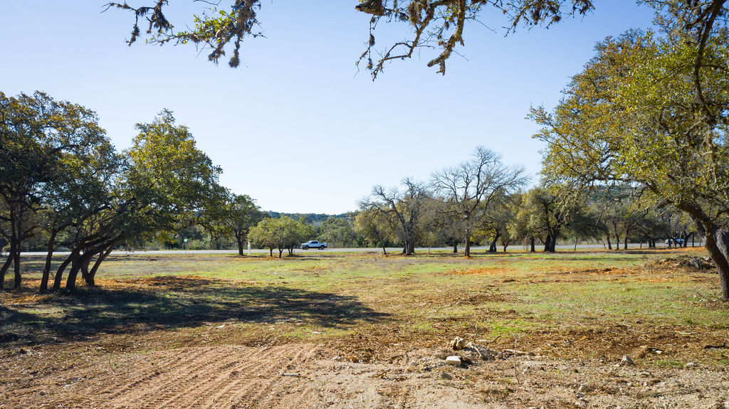 268 Kinnikinik Loop Austin, TX 78737 - Photo 21 of 23 a view of a lake with a yard