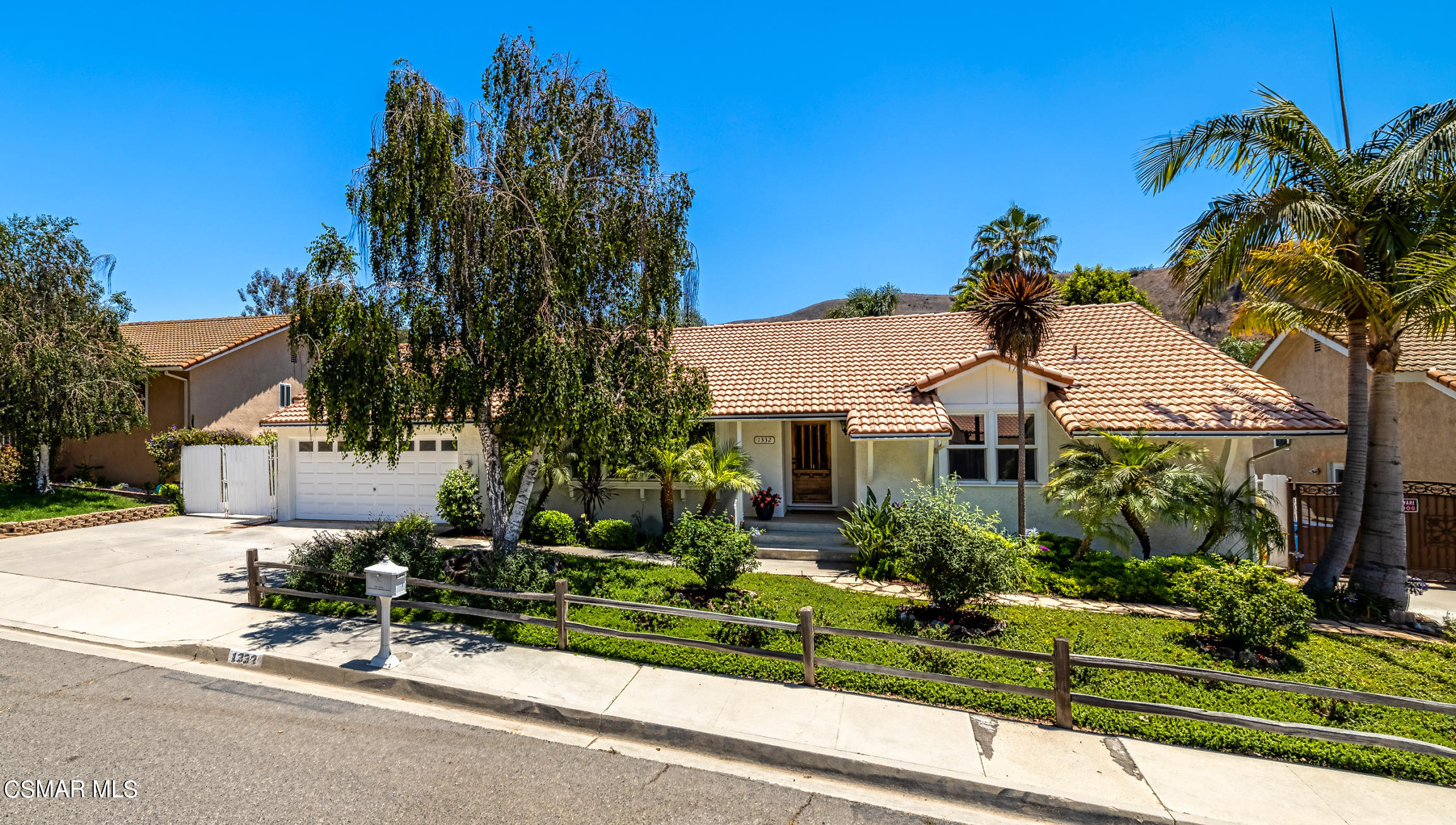 1332 Rambling Road Simi Valley, CA 93065 - Photo 1 of 1 a front view of a house with a yard and potted plants