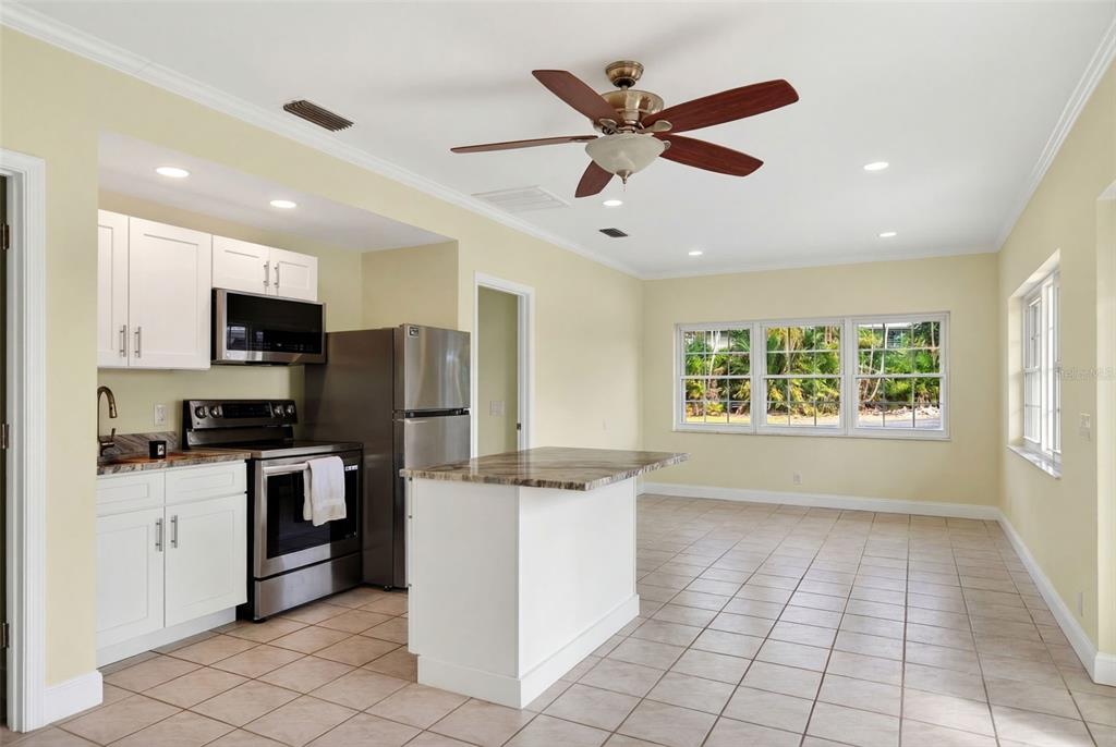 7108 Midnight Pass Road Sarasota, FL 34242 - Photo 47 of 83 a kitchen with granite countertop appliances cabinets and a sink