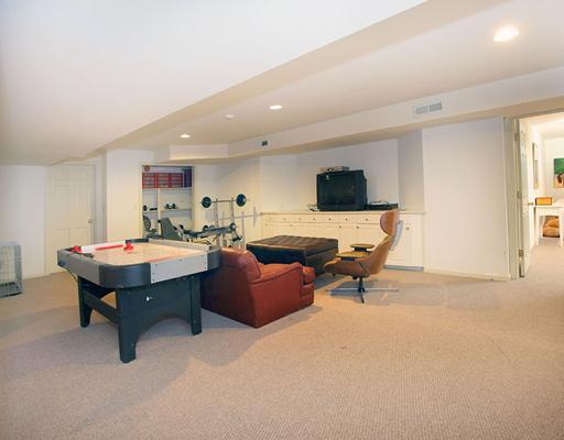 5 Shields Lane Darien, CT 06820 - Photo 12 of 20 a living room with furniture and a flat screen tv
